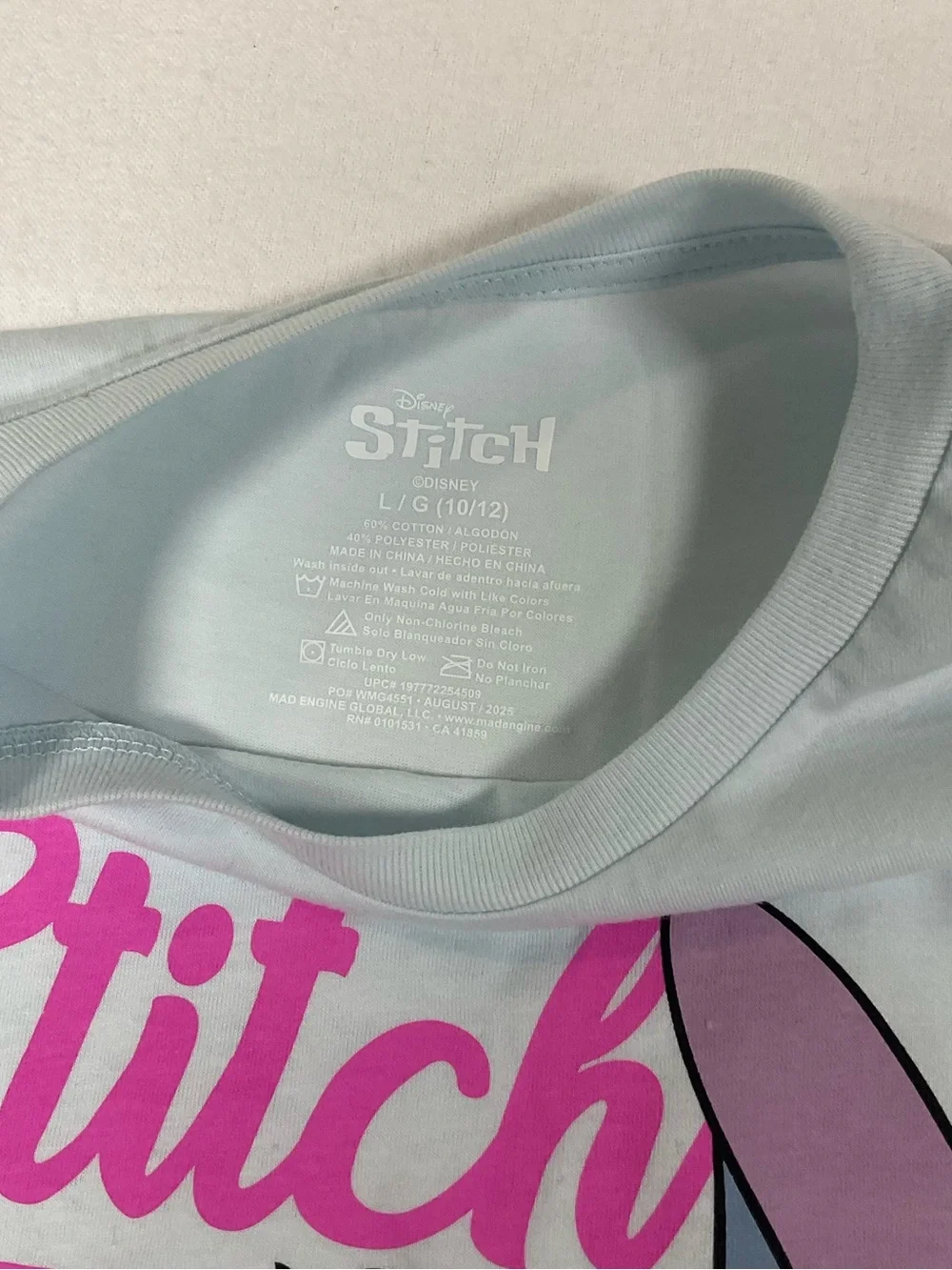 Disney Light Blue Stitch Tee with Pink and Purple. New with Tag.size L(10/12)